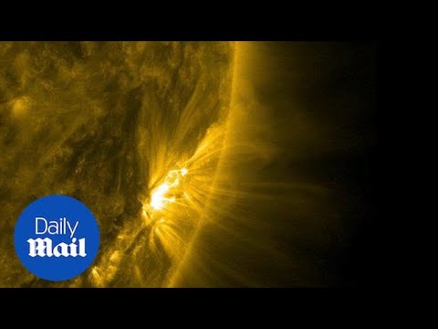 NASA watches magnetic arches tower over sun&#039;s surface - Daily Mail