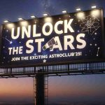 A high-definition, realistic image showcasing a billboard with the text 'Unlock the Stars: Join the Exciting AstroClub’25!'. The billboard stands out against an evening sky filled with sparkling stars. The words 'Unlock the Stars' are predominantly displayed in bold, attention-grabbing letters, while the phrase 'Join the Exciting AstroClub'25!' is inscribed below in a slightly smaller font. The overall theme could incorporate elements related to astronomy, like telescopes, constellations, galaxies, and perhaps a few aspiring astronomers gazing skyward with wonder.